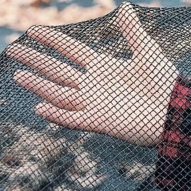 Aqua Coastal 24-foot round leaf net pool cover with mesh design, designed for quick spring cleanup and debris removal from pool.